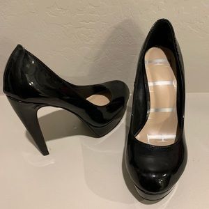 Black round toe pumps.